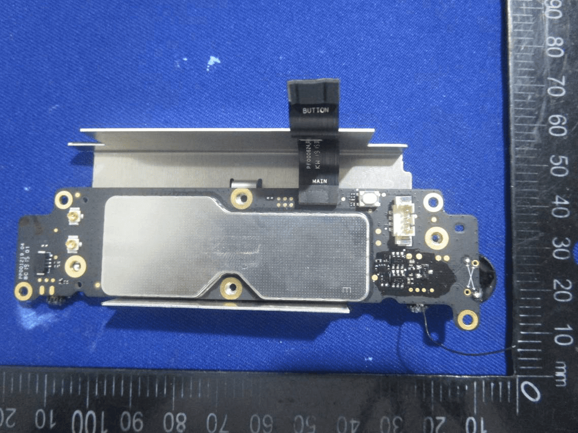 Main flight controller PCB with EMI shield and modular connectors.