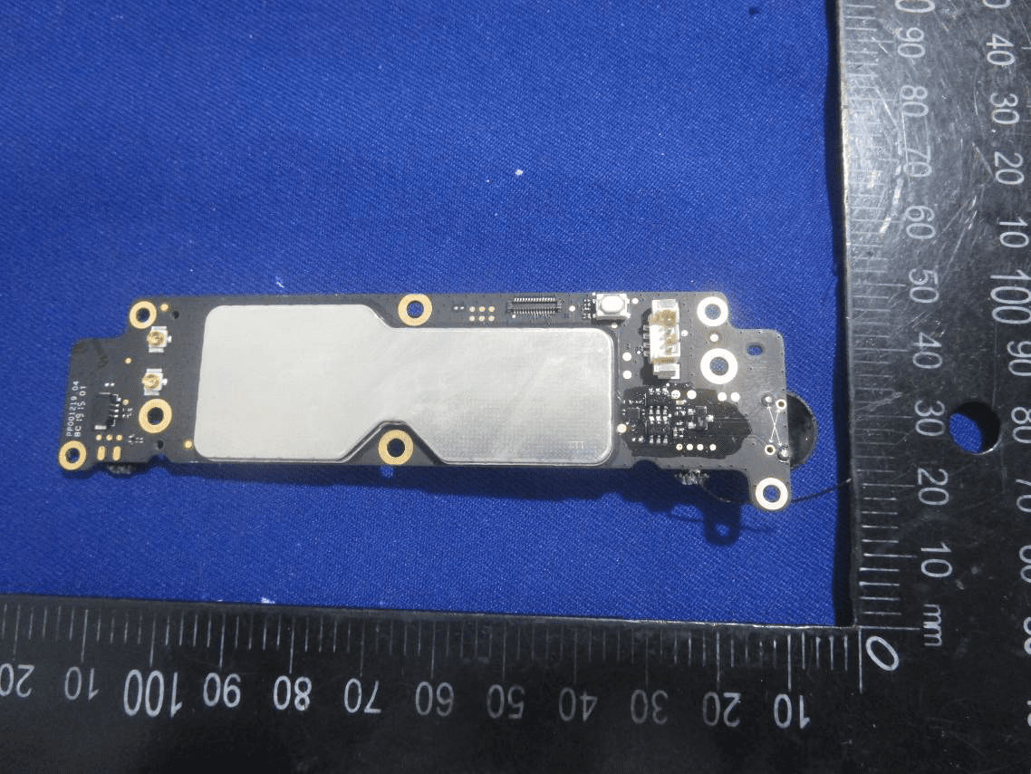 Shielded RF/control module PCB with antenna feed and power regulation.