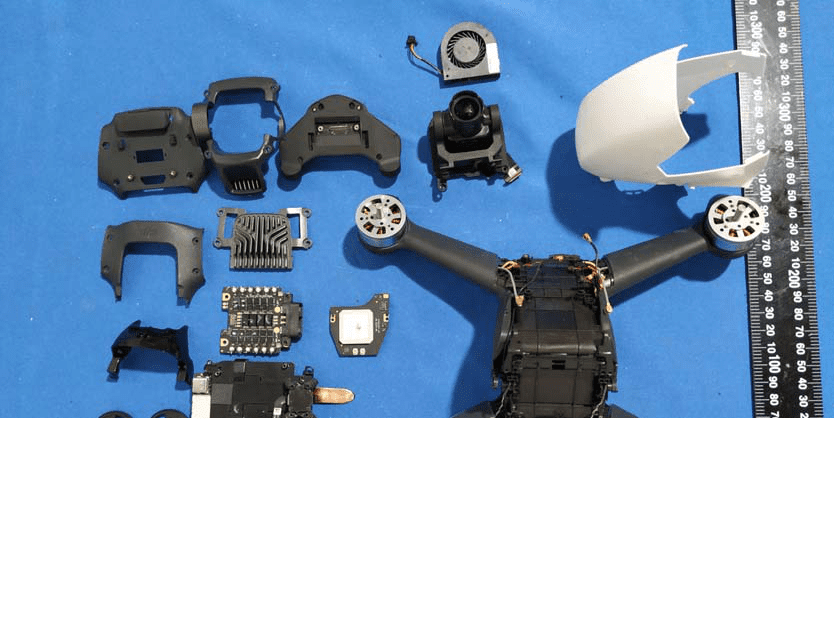 Main PCB, GPS module, power distribution, and advanced shielding in DJI FPV drone.