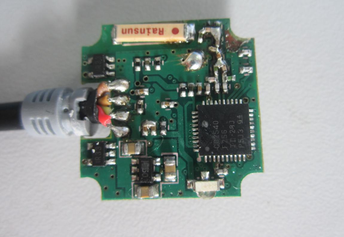 Compact PCB with QFN540 IC and Crystal Oscillator.