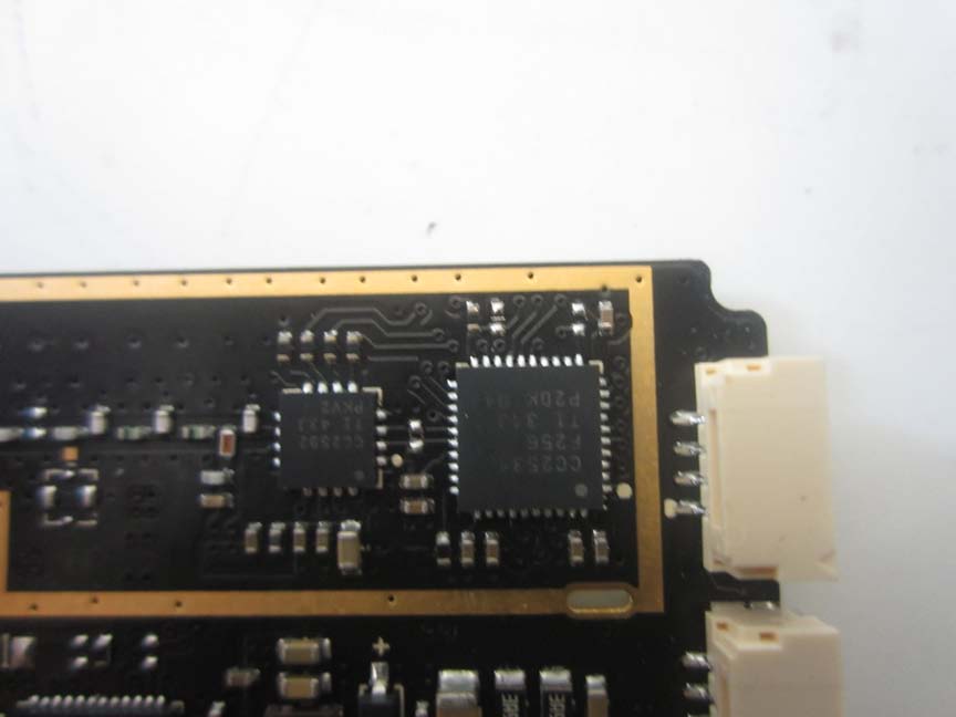 Compact PCB with key ICs and modular connectors.