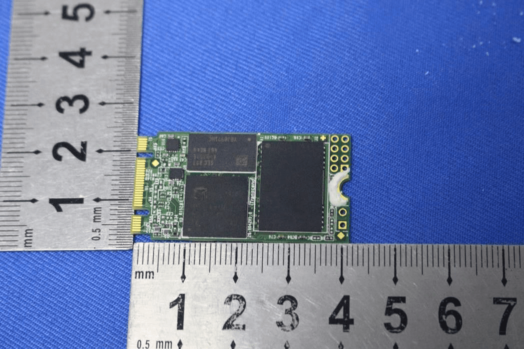 M.2 storage module with NAND memory and high-speed edge connector.