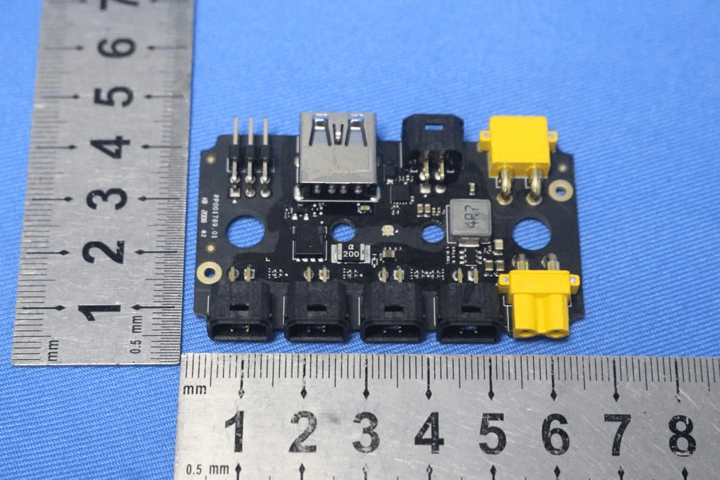 Power distribution board with XT30 connectors and USB-A for modular expansion.