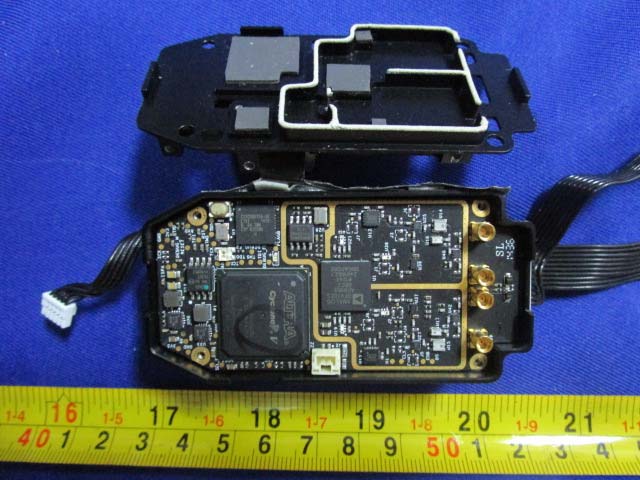PCB with SoC, shielding, and antenna connectors for wireless communication.