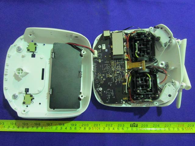 PCB with RF components under metal shielding for EMI protection.