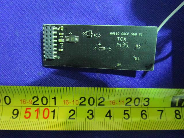 PCB with '5G' marking and wire antenna for high-frequency communication.