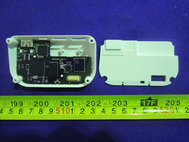 Main PCB featuring central SoC and power regulation components.