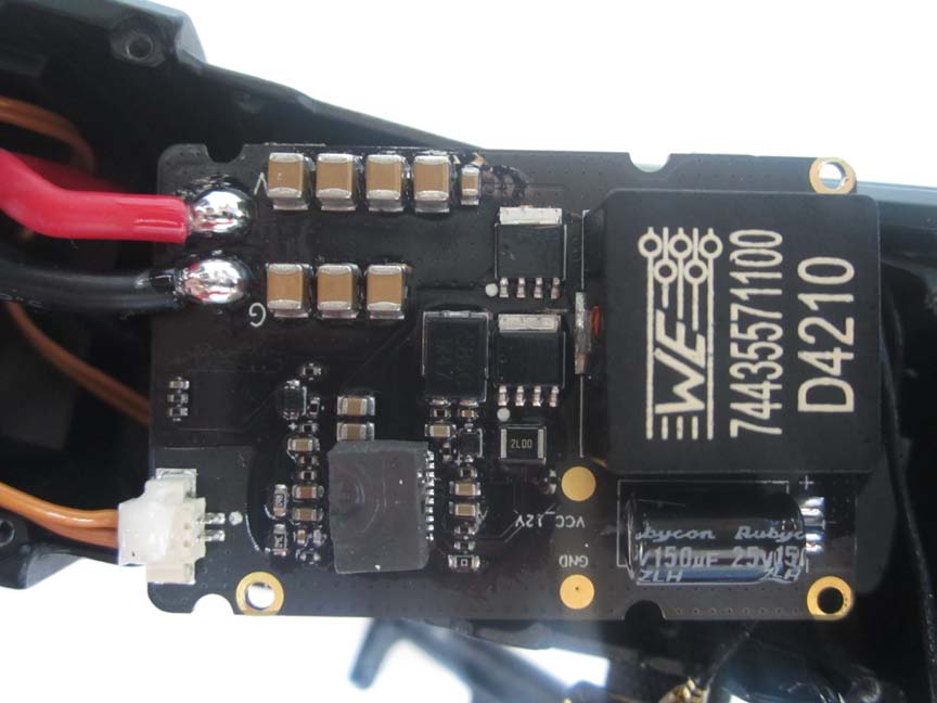Power management PCB with large inductor and voltage regulators.