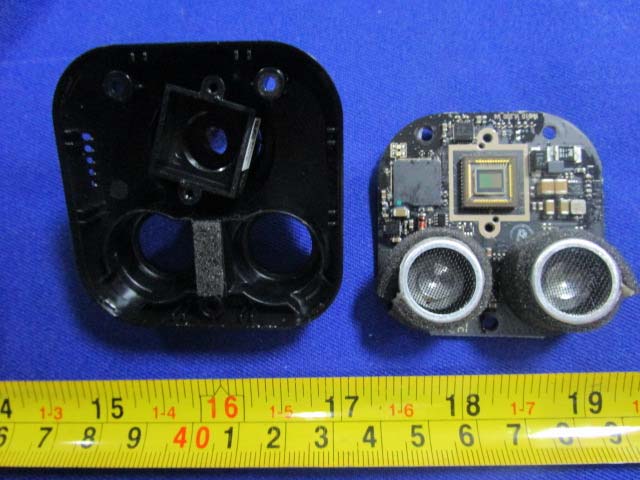 Visual positioning module with CMOS sensor and ultrasonic transducers.