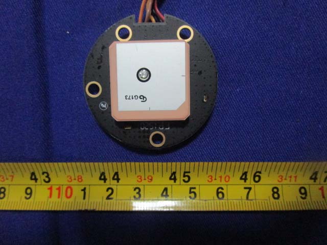 Ceramic patch antenna for GPS L1 band reception on circular PCB.