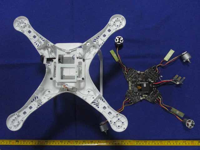 Main flight controller PCB with motor assemblies and modular wiring.