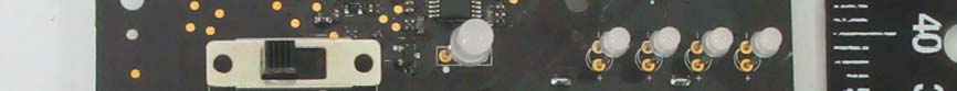 User interface and debug PCB section with slide switch and tactile test points.