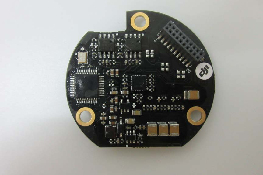 Circular main PCB with motor drivers, MCU, and robust power management.