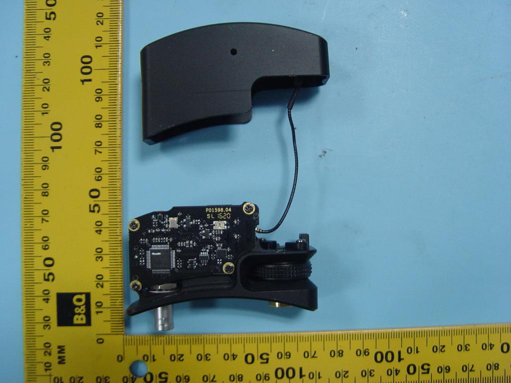 Main PCB with controller IC, rotary encoder, and coax-fed antenna.