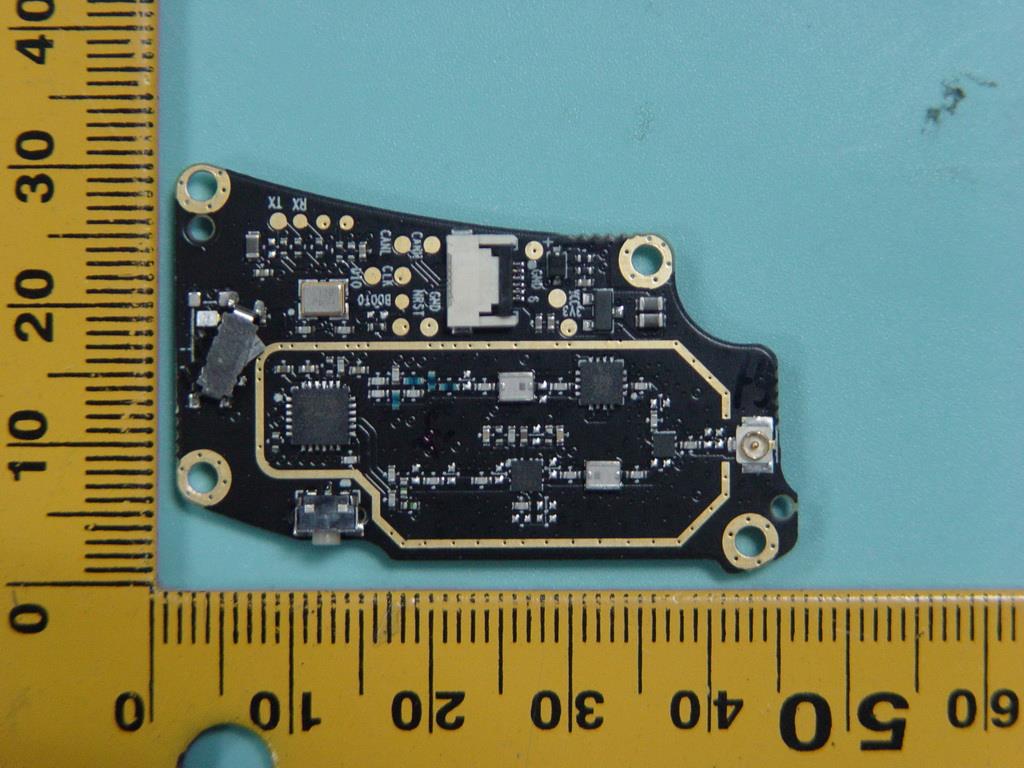 Dense PCB with SoC, U.FL antenna, and EMI shielding.