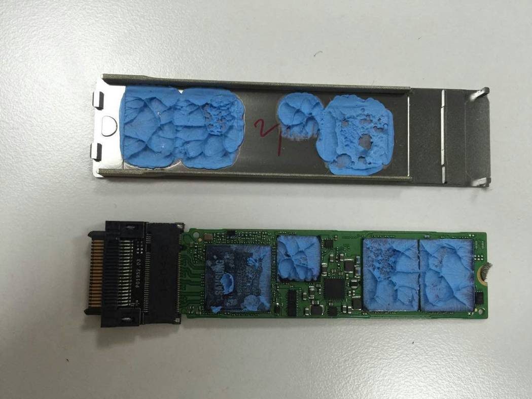 Component side with NAND flash, controller, and thermal pads.