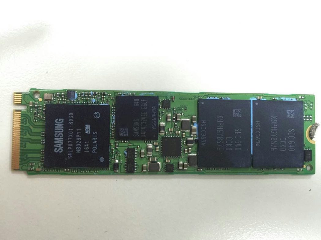 Close-up of SSD controller, NAND flash, and DRAM cache.