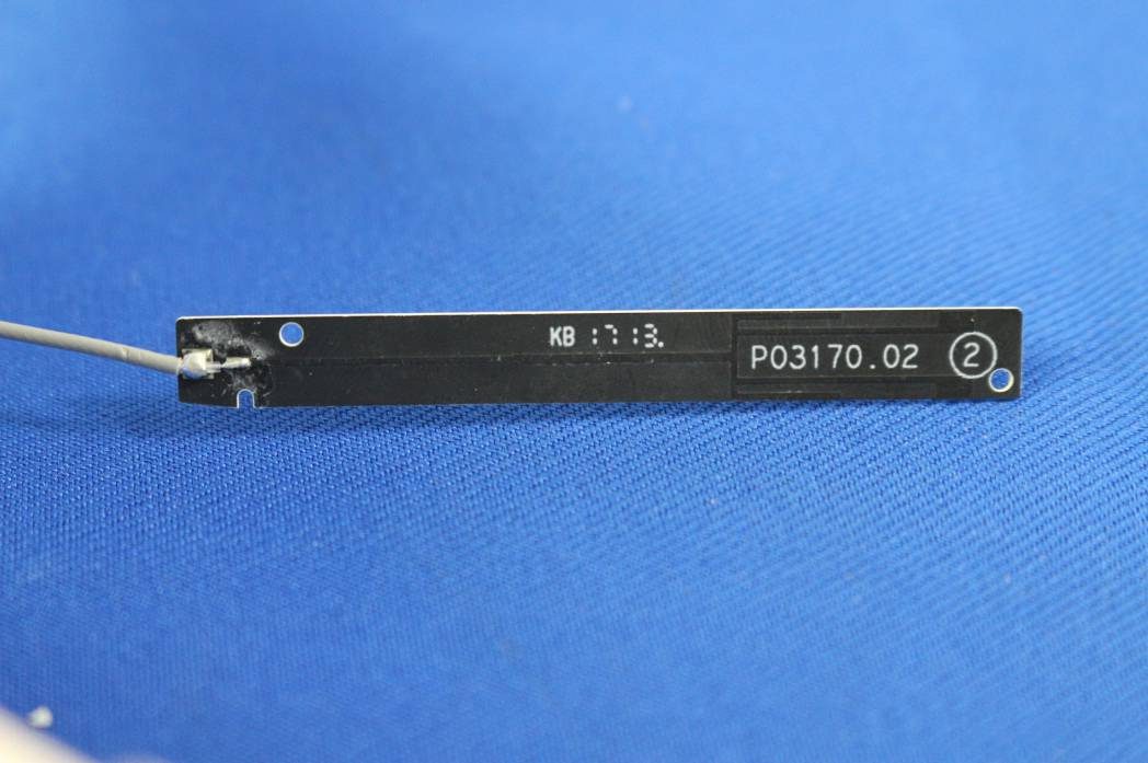 PCB antenna with coaxial cable for RF signal routing.