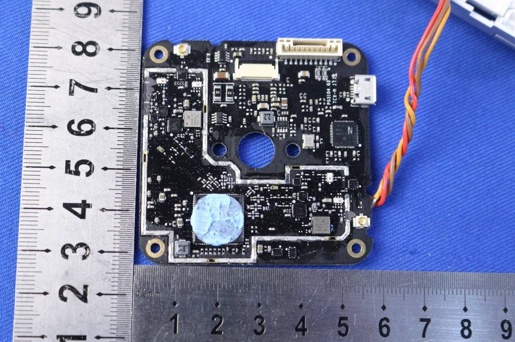 Flight controller PCB with MCU, power management, and modular connectors.