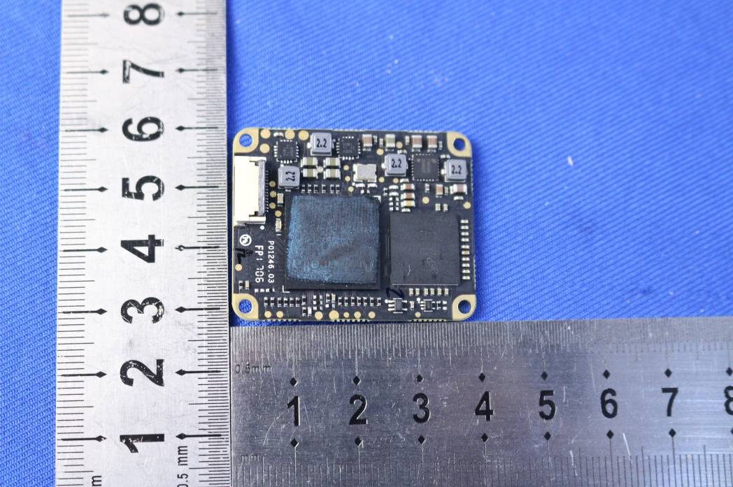 High-density logic board with processor and memory for flight or comms.