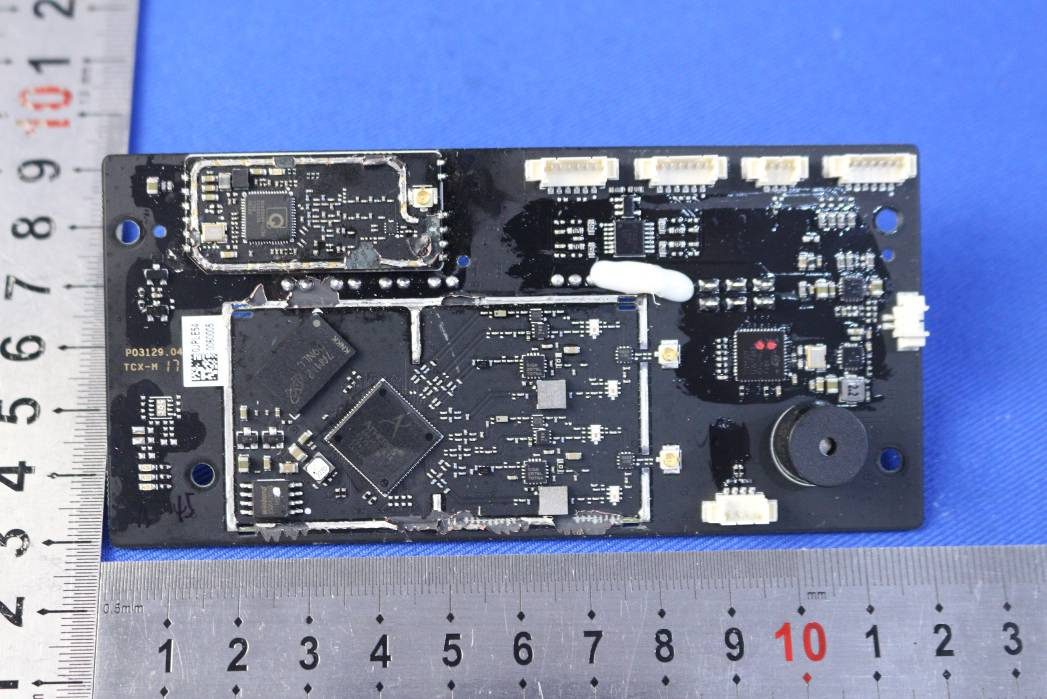Central controller PCB with FPGA, RF shielding, and modular connectors.
