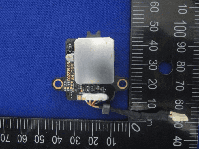 Compact shielded module with coaxial RF cable and multipin connector.
