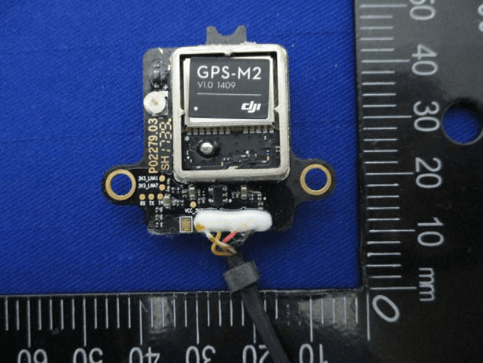 Shielded GPS module with coaxial antenna feed and robust grounding.