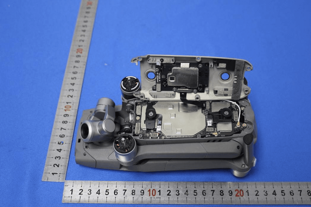 Main PCB with shielding, connectors, and partial gimbal/camera assembly.