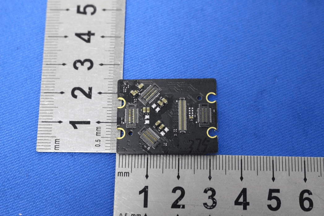 Sensor interface board with multiple ICs and high-density connectors.