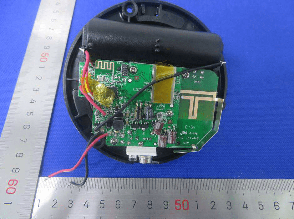 Round PCB with trace antenna and integrated battery compartment.