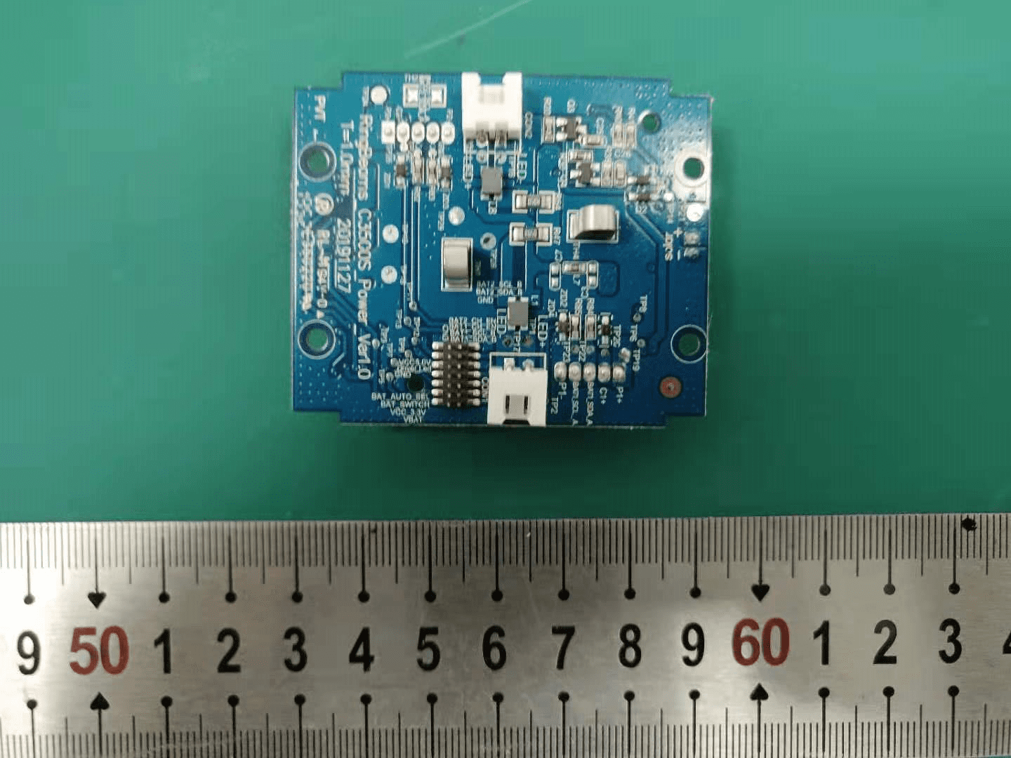 Power and signal interface board with inductors, connectors, and programming header.