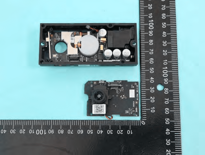 Main PCB with SoC shield and camera module; modular, high-density layout.