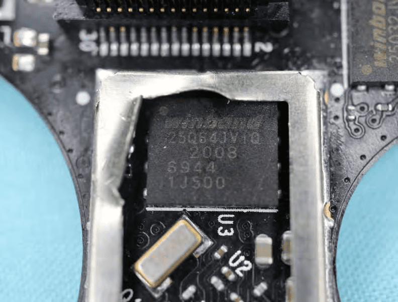 Winbond flash memory, crystal oscillator, and shielded RF section.
