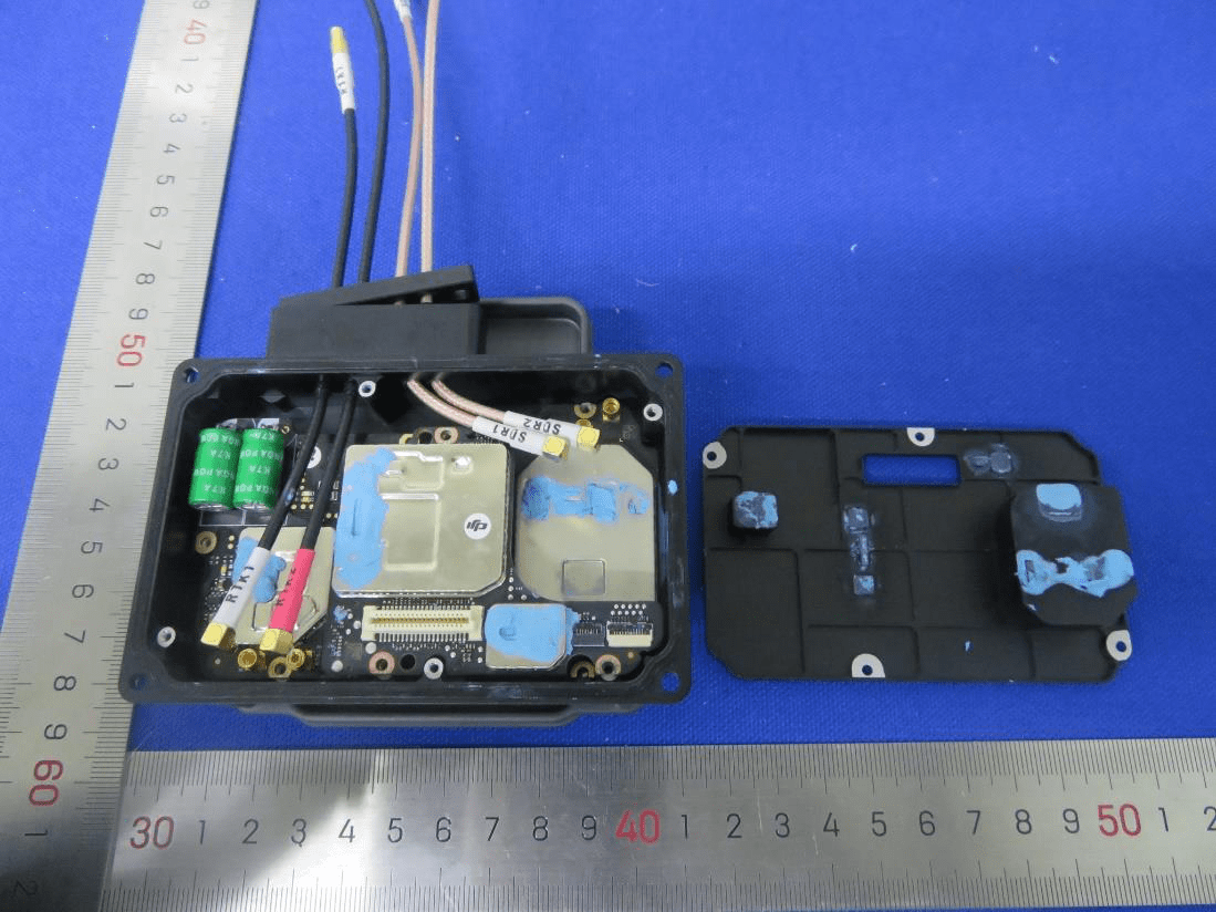 Shielded RF and processing module with multiple coaxial and power connectors.