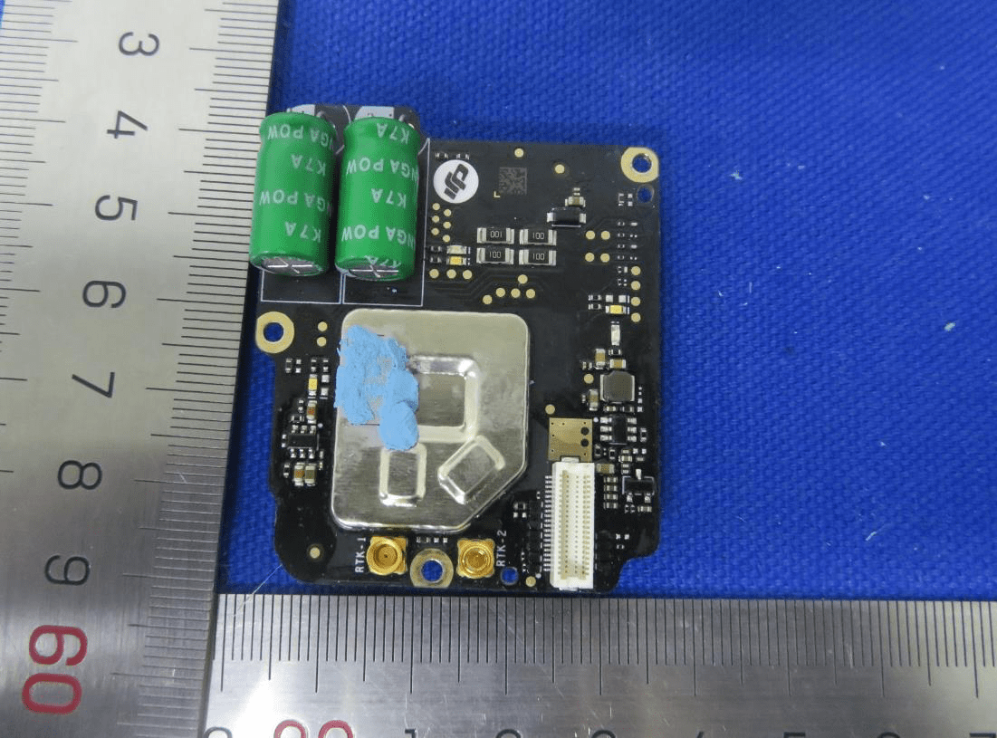 GNSS/RTK module with dual antenna connectors and heavy EMI shielding.