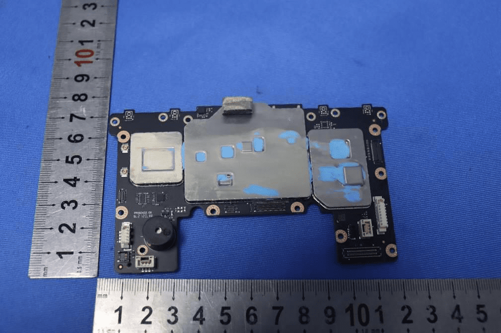 Main PCB with extensive EMI shielding and modular connectors.