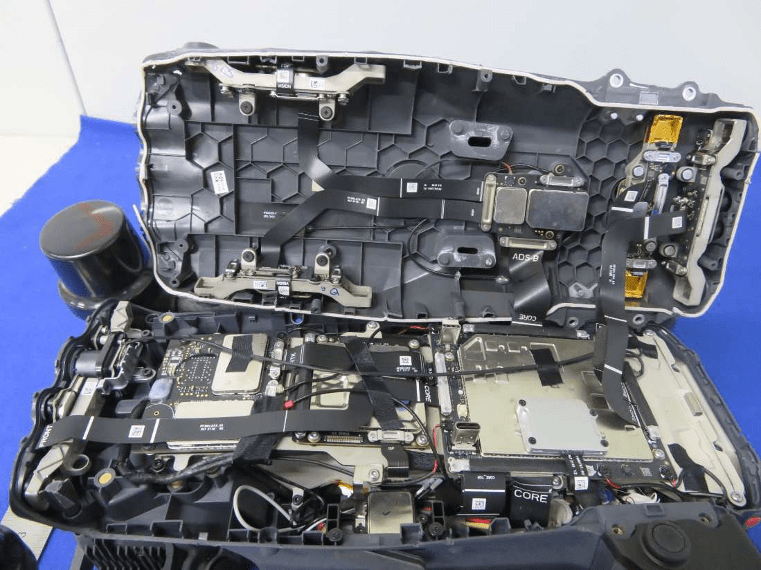 Main PCB assembly with extensive shielding, modular sections, and robust power management.