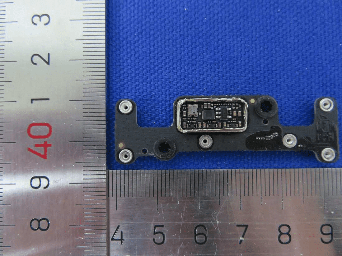 Densely populated sensor/control PCB with shield can for EMI suppression and reliability.