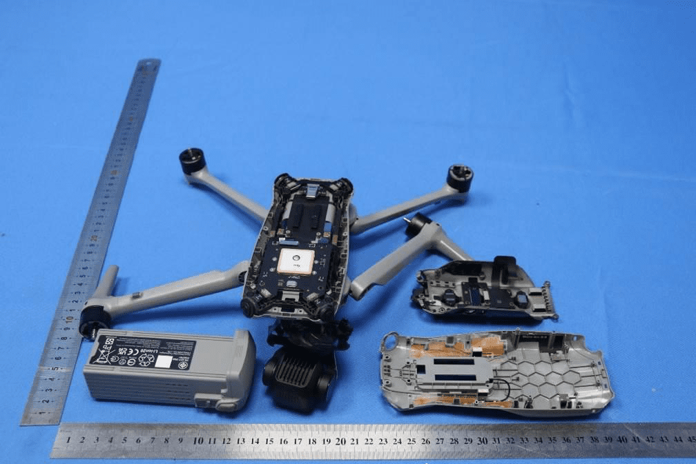 Drone assembly showing shielded PCB, battery, and integrated antenna structures.