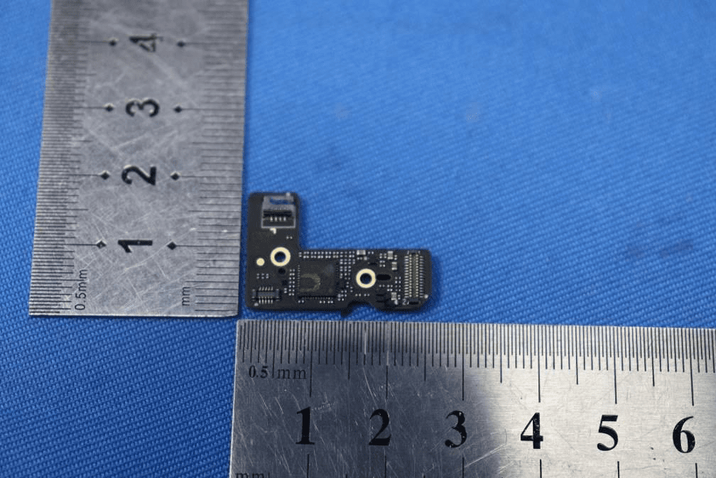 Miniature sensor/interface PCB with dense QFN ICs and precision FPC connector.