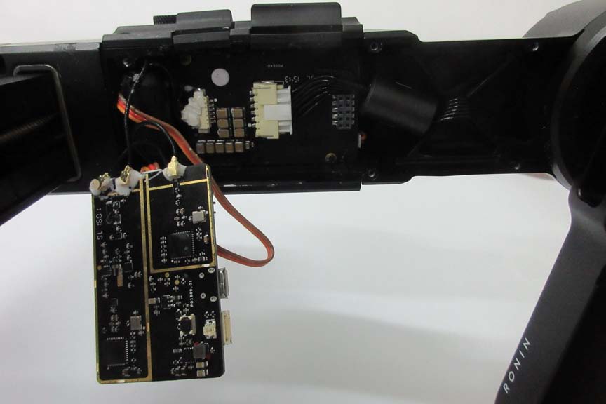 Main system PCB with MCU, motor drivers, and possible RF antenna feed.