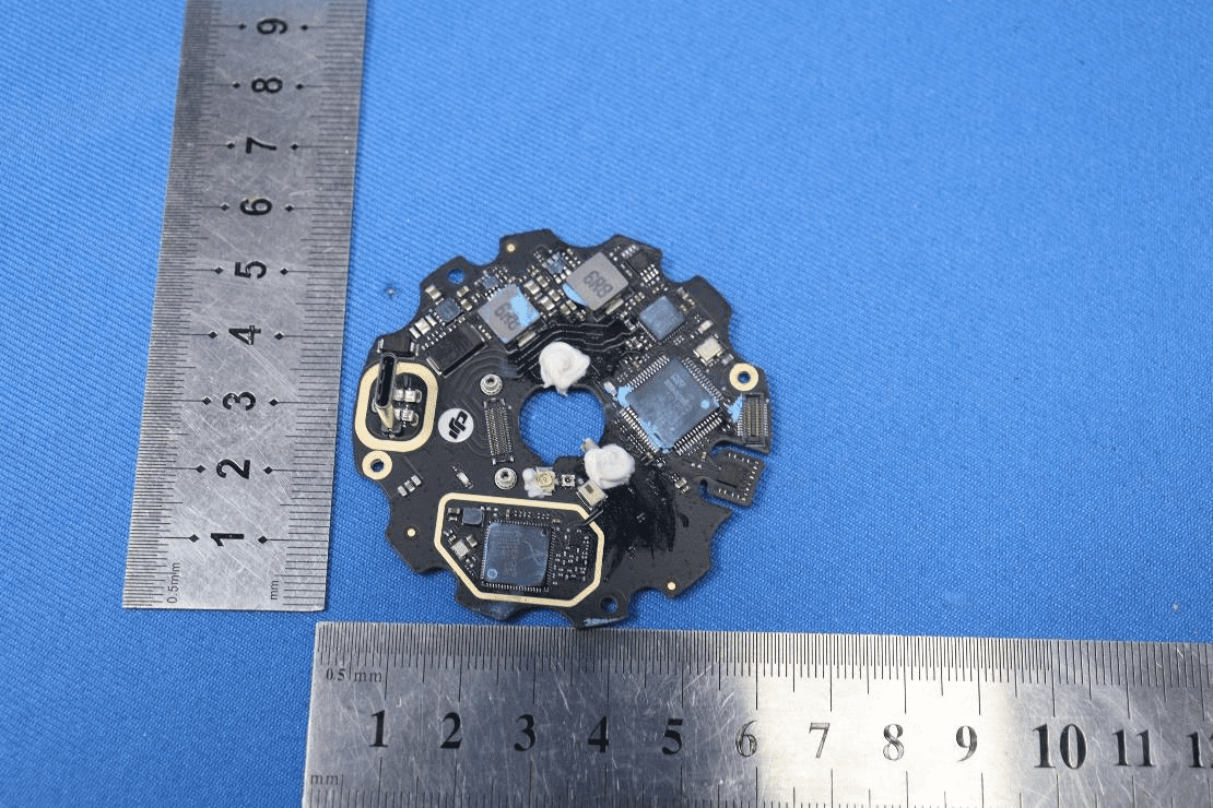 Compact flight controller PCB with high-integration ICs and modular connectors.