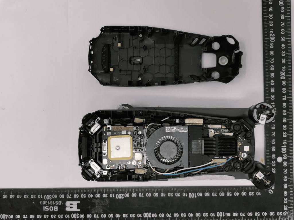 Main PCB with GNSS module, power, and RF shielding under active cooling.