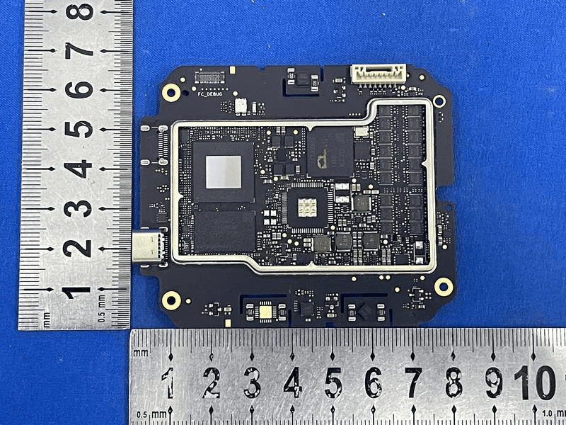 High-density flight controller PCB with BGA SoC and RF connector.