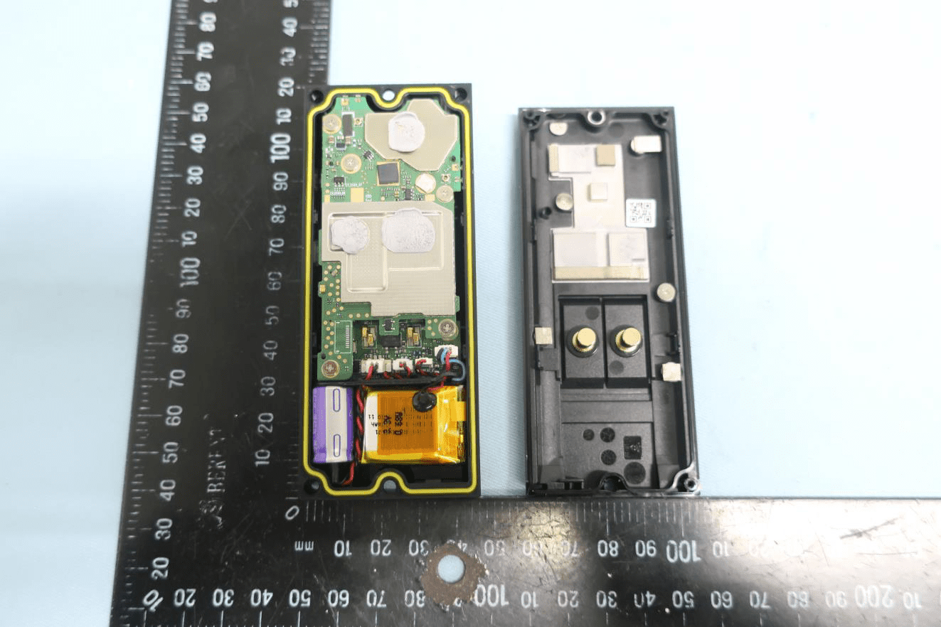 Main PCB with EMI shields, battery, and modular wiring harnesses.