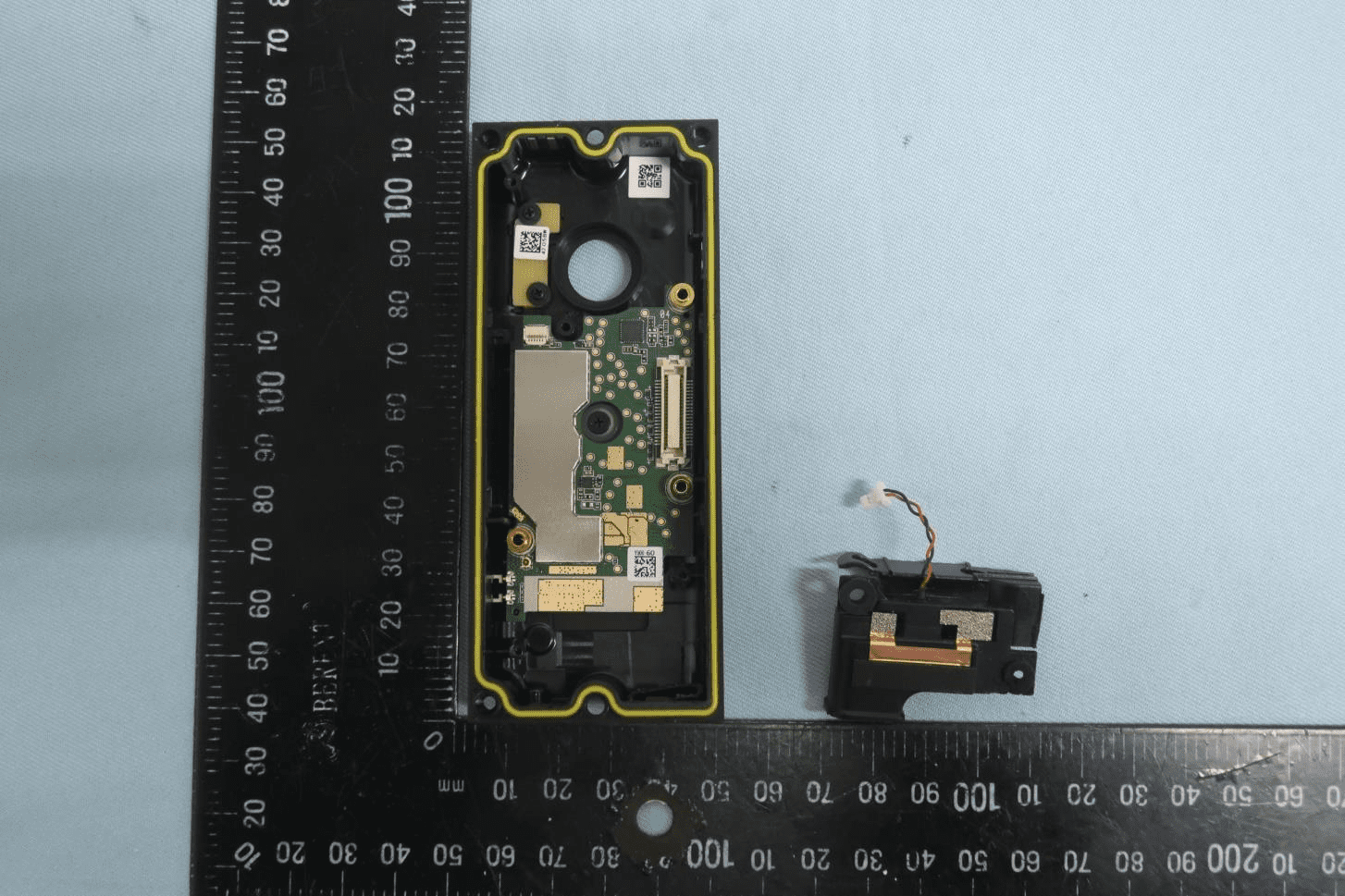 Main PCB with integrated Wi-Fi/Bluetooth antenna and detached speaker module.