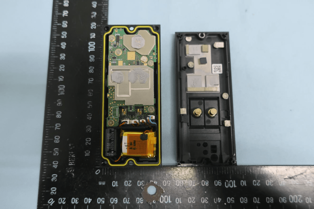 PCB with EMI shields, Li-ion battery, and gold power contacts for doorbell wiring.